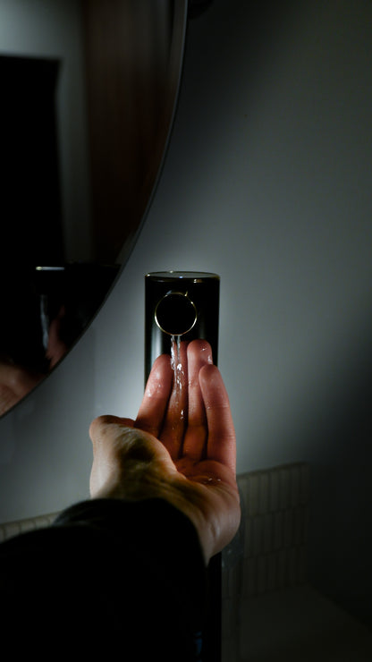 Person doing wudu with Wuduce's Wudu Water Dispenser