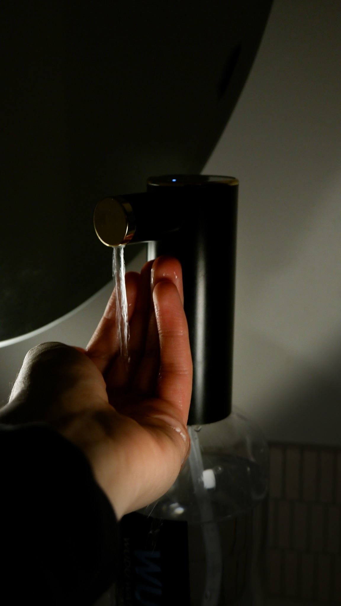 Man doing wudu with the Wudu Water Dispenser