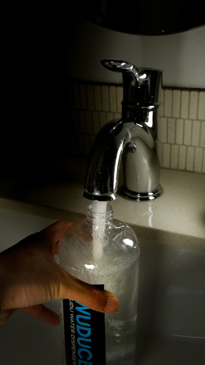 Wudu Dispenser bottle being filled up in bathroom